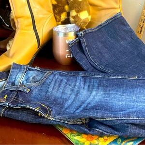 Distressed Rock & Republic mid rise jeans. Love these. They do have some stretch